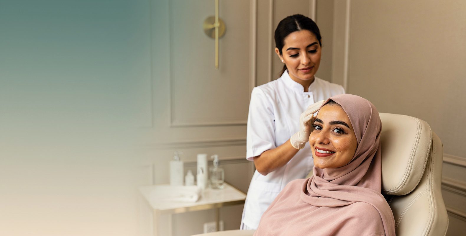 An aesthetician gently checking a smiling woman's skin in a calm clinic room