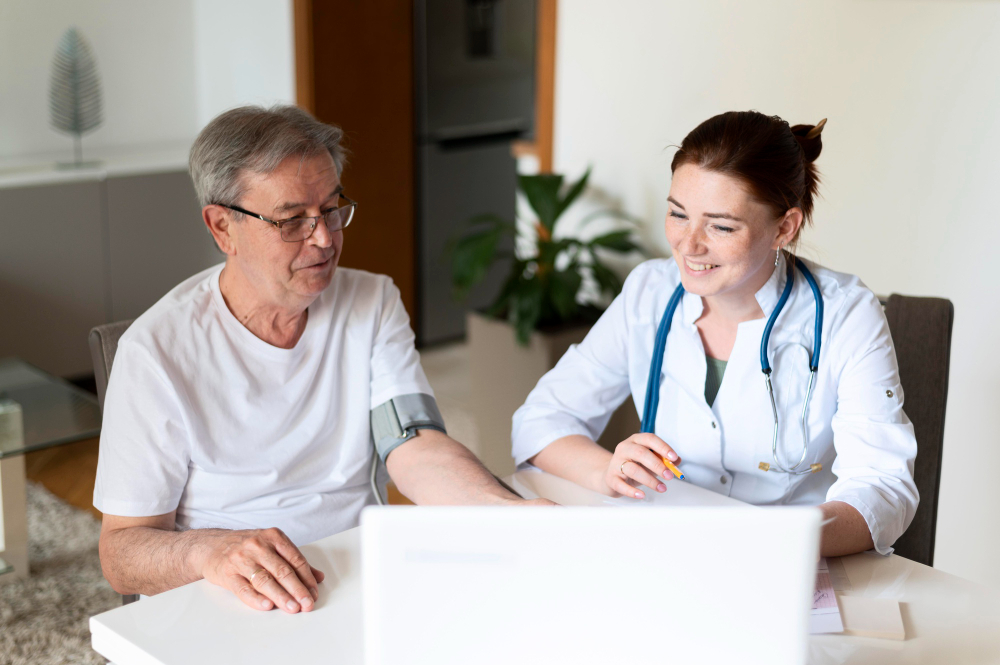 Care adviser assisting a patient